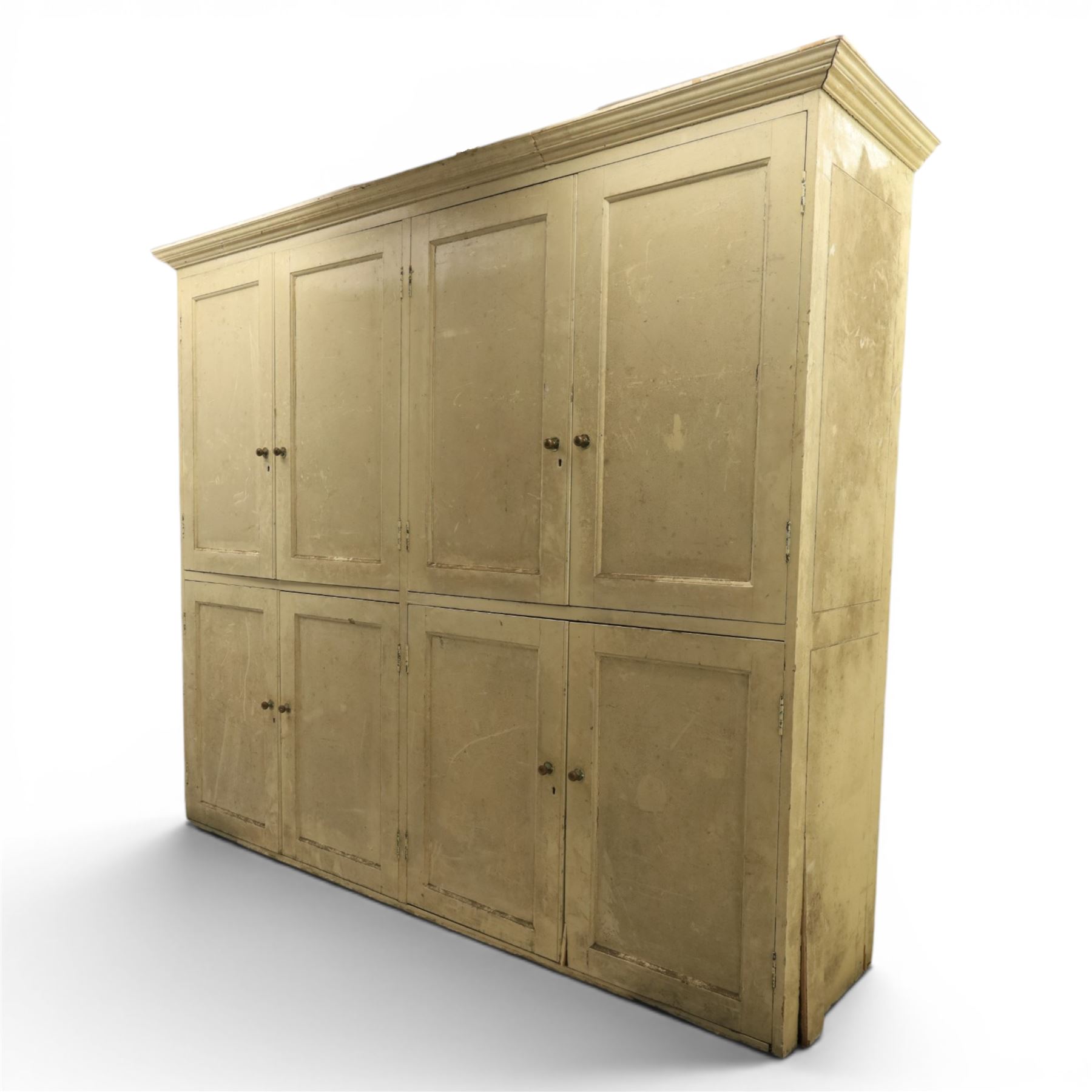 Large Georgian painted pine housekeepers cupboard, projecting cornice with four sets of twin cupboard doors with shelving enclosed