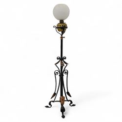 Early 20th-century Art Nouveau style standard lamp, wrought iron scrolled tripod base with...