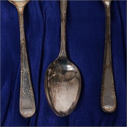 Set of  of six silver coffee spoons and tongs with bright cut decoration Sheffield 1908 Maker Cooper Bros. and another set of six coffee spoons with decorative terminals