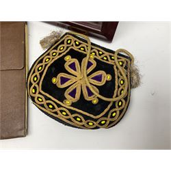 Continental petit point evening bag, with enamel and pearl details, in wooden display frame, together with a snake skin handbag and three other vintage bags