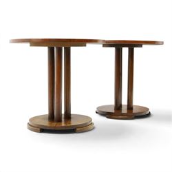 Pair of early 20th century oak lamp tables, circular tops raised on cluster-column pedestals, with circular platform bases and shaped bracket feet (2)