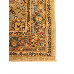 Ziegler-style machine-made rug, beige ground with a multicoloured central medallion and floral motifs, spandrels with scrolling designs, framed by a decorative border with intricate patterns