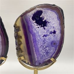 Pair of purple agate slices, polished with rough edges raised upon gilt metal stands