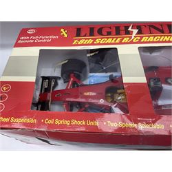 PMS Lightning 1:8 scale remote control racing car; Soma Sonic Man battery operated electronic sounds and light action figure; and CGL Galaxy Invader 10000 computer space battle game; all boxed (3)
