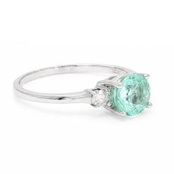 18ct white gold Paraiba tourmaline and diamond three stone ring, single round cut tourmaline of approx 1.50 carat, with a single round brilliant cut diamond set either side, hallmarked, total diamond weight approx 0.15 carat