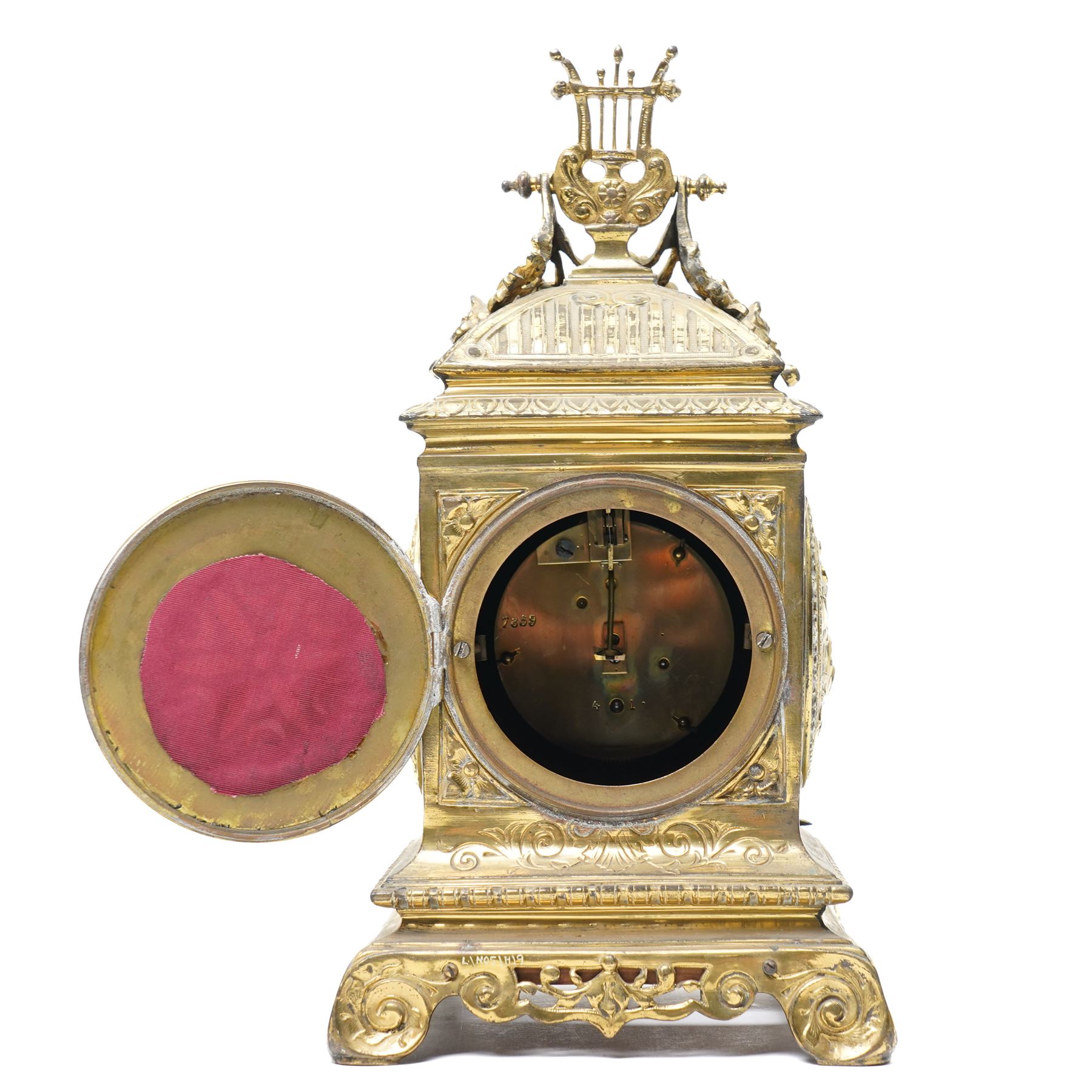Early 20th century mantel clock with white enamel dial, French timepiece movement and recoil anchor escapement in brass case with lyre finial, trailing garlands and wreaths etc on scroll feet H30cm 
Provenance: property of a Nobleman
