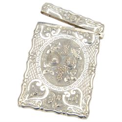 Victorian silver card case, of rectangular form with shaped borders, relief embossed with fruit and flowers and engraved with monogram, hallmarked George Unite & Sons, Birmingham 1875, H9.5cm, contained within fitted tooled leather case
