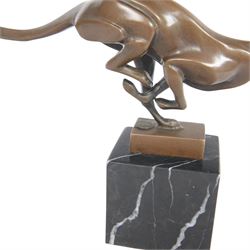 Bronze figure, modelled as a running cheetah, with foundry mark, raised upon a marble base, H20cm
