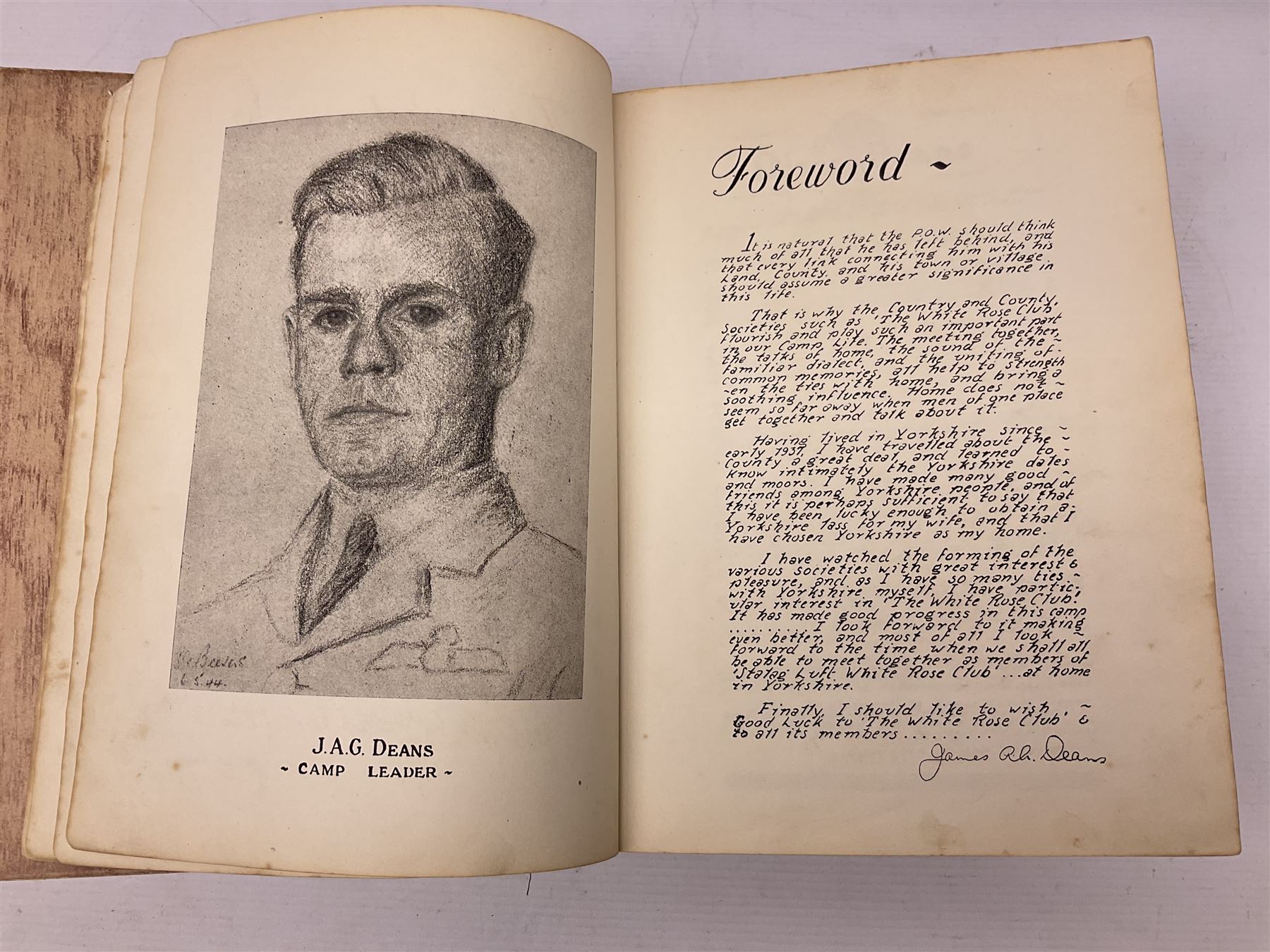 The Yorkshire Post Kriegie Edition. A 1945 book reproducing the exploits of Prisoners of War in Stalag Luft VI, with compliments letter from the publishers. Simulated wood paper covered card boards.