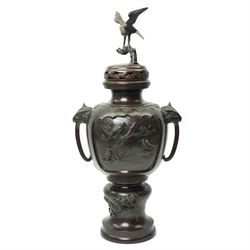 Japanese late Meiji period bronze koro and cover, surmounted by an eagle finial and with b...