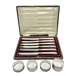 Cased set of six silver handled knives, hallmarked George Wish & Co, Sheffield, together with two hallmarked silver napkin rings stamped Birmingham 1937 and 1945 and pair of napkin rings stamped 'Silver'