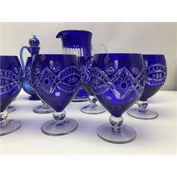Bristol blue glass jug, together with blue claret jug, saucer, blue cut water jug, and seven matching glasses, water jug H22cm