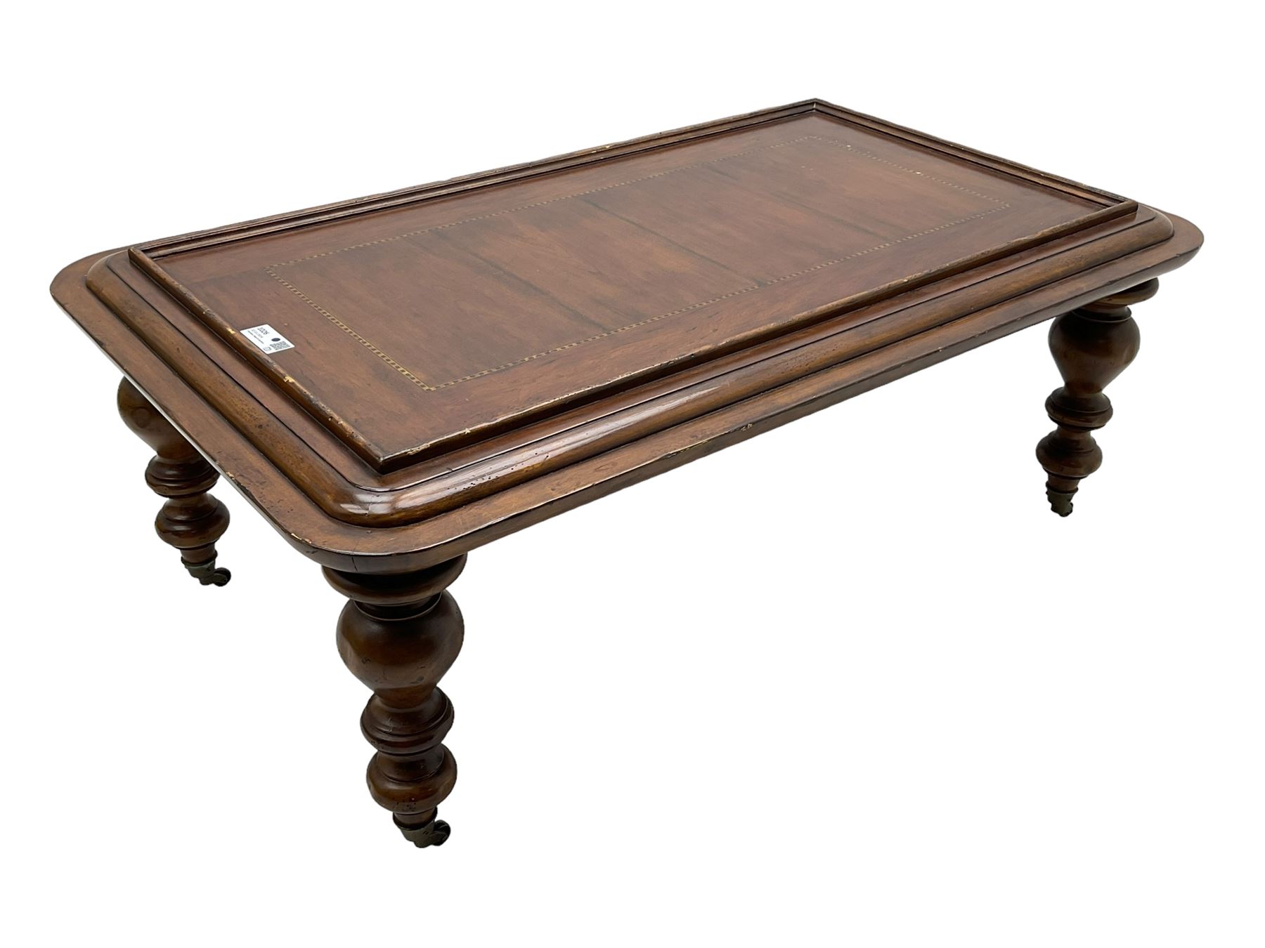 Milling Road - cherry wood coffee table, rectangular top with rounded corners, on turned feet with castors