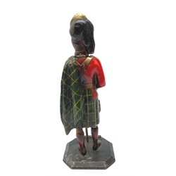  20th century spelter table lighter painted in Scottish Highland Regiment colours, on octagonal base, with lifting head H24cm  
