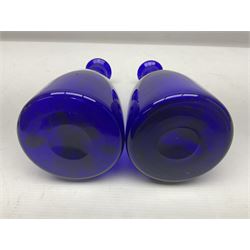 Pair of early 19th century blue glass decanters with teardrop stoppers, with gilt writing, the first marked Gin the second Brandy 