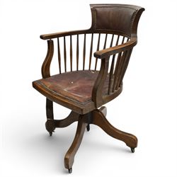 Late 19th century twin-pedestal desk, red leather inset top over an assortment of eleven drawers, on plinth base (W126cm D65cm H77cm); with Edwardian oak framed Captains swivel desk chair, of tub shaped form with spindle back supports (W60cm H89cm)