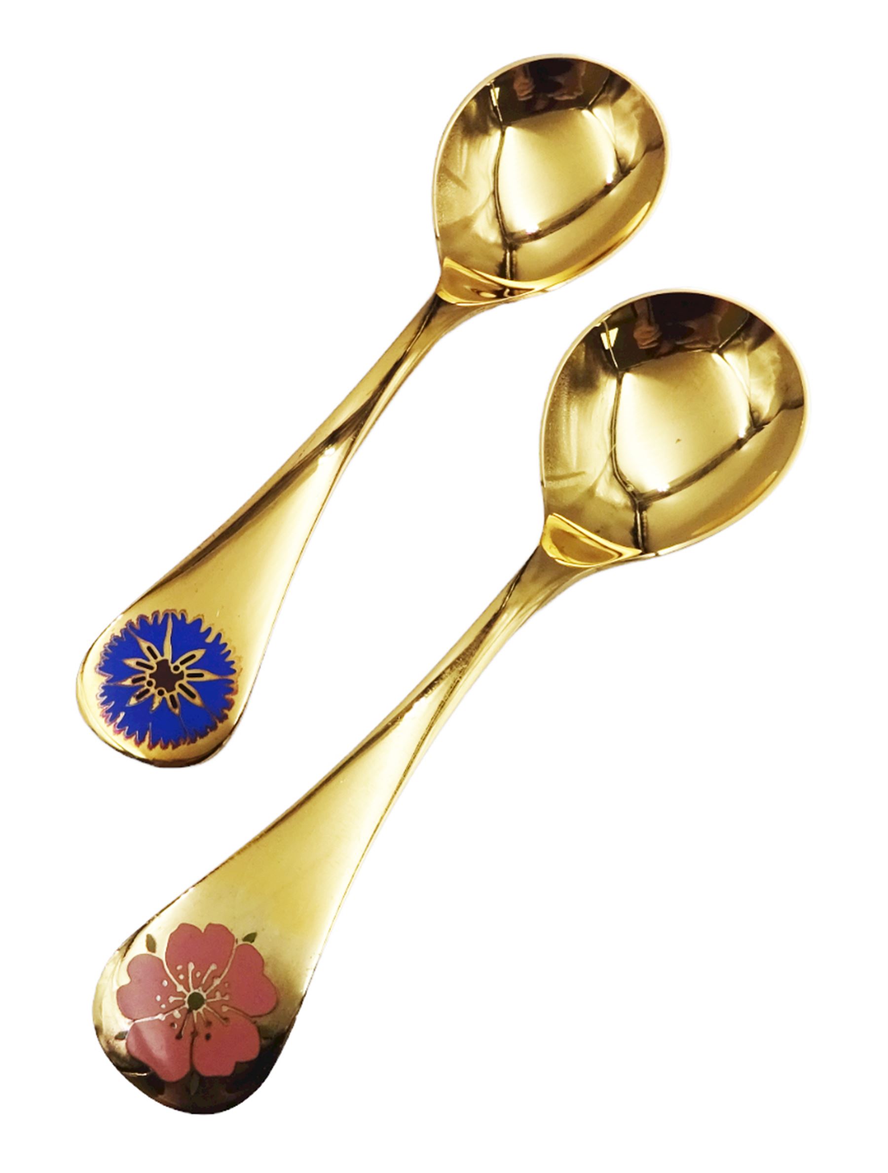 Two Danish silver-gilt year spoons by Georg Jensen, the first example decorated with enamel blue cornflower motif, dated 1972, in original pouch, the second example decorated with enamel pink briar rose motif, dated 1976, in original box, each impressed on underside RA AB, Sterling Denmark, and marked for Georg Jensen, together with two further examples by A.Michelson, the first with orange enamel fan design, dated 1965, impressed on underside A.Michelsen Sterling Danmark, TH, the second with enamel family scene, dated 1973, impressed on underside 925 S A.Michelsen Sterling Danmark, B Spang Olsen, approximate gross weight 6.11ozt (190.4 grams)