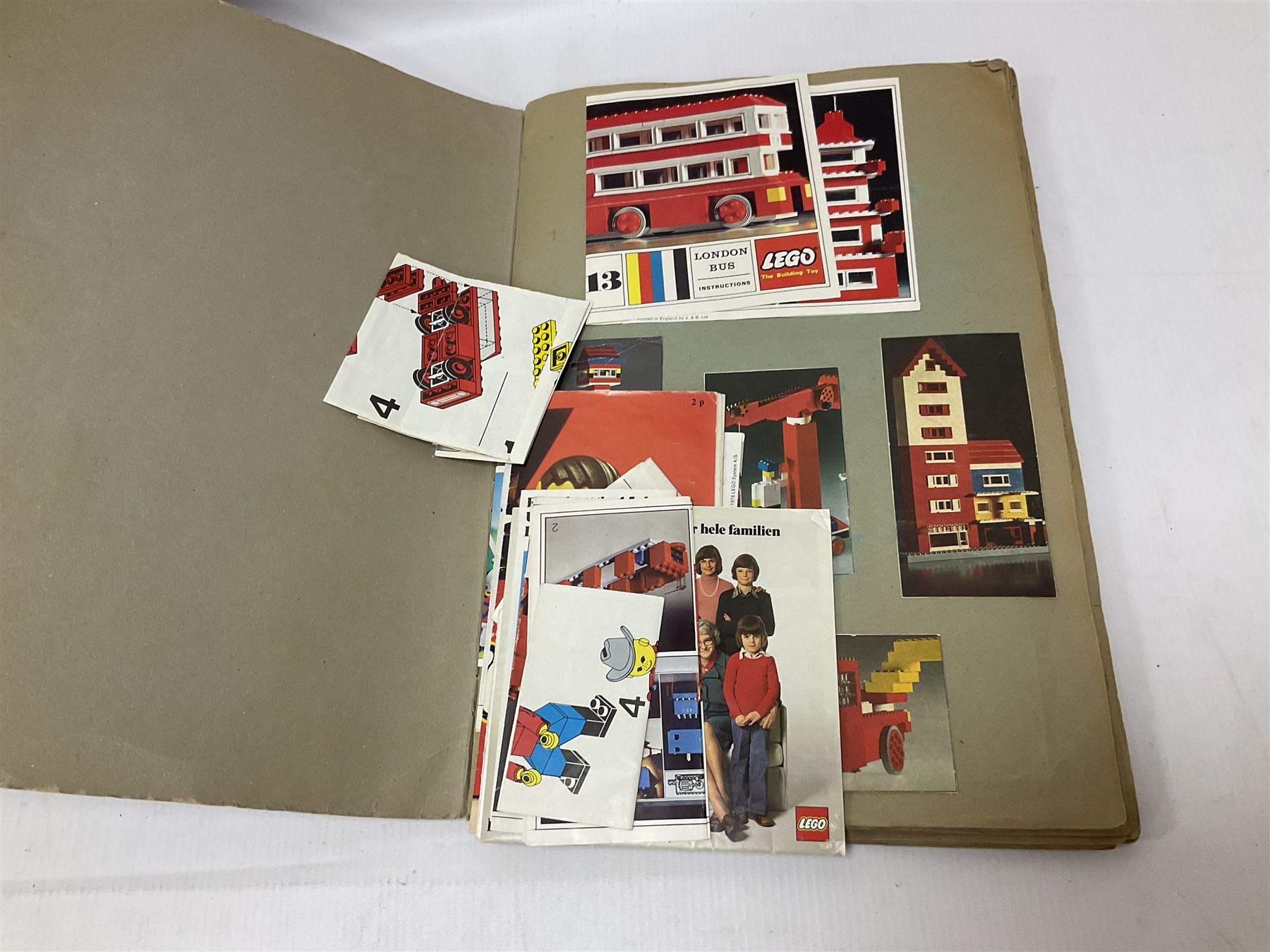 Fischer Technik/Lego/Playmobil - thirteen model building sets comprising eight Fischer Technik sets 50, 50/1, 50v, 50/2, 50+mot1 and two 50S, 50/1 add-on pack, with spare parts packs 01, 03, 05, two 22 and 30; two Lego sets comprising C107 and Lego Systems 103, part-set 870 and 970; Playmobil no.3520 set; four boxes of loose lego, various instruction manuals and a scrapbook 