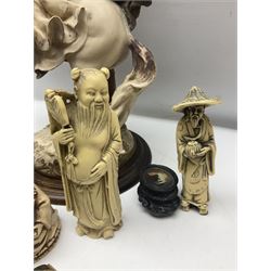 Composite figure of a couple upon a rearing horse, together with a collection of resin immortals and two bone chests 