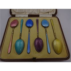 Set of six 1920s silver-gilt and harlequin enamel coffee spoons, each decorated in pastel guilloche enamel, hallmarked William Suckling Ltd, Birmingham 1929, contained within fitted case