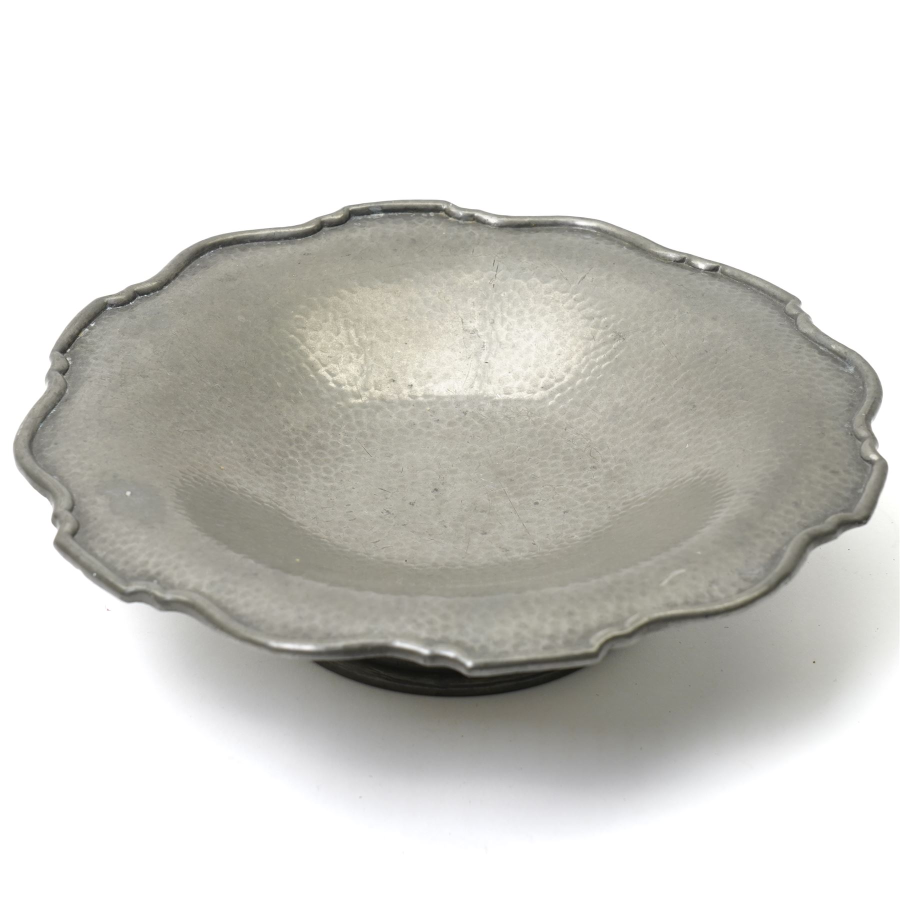 Early 20th century Arts & Crafts fruit dish by Walter Somerfield of the Leicester Art School, H16.5cm; silver plated tea service with trailing floral decoration, and various other hammered pewter items (8)