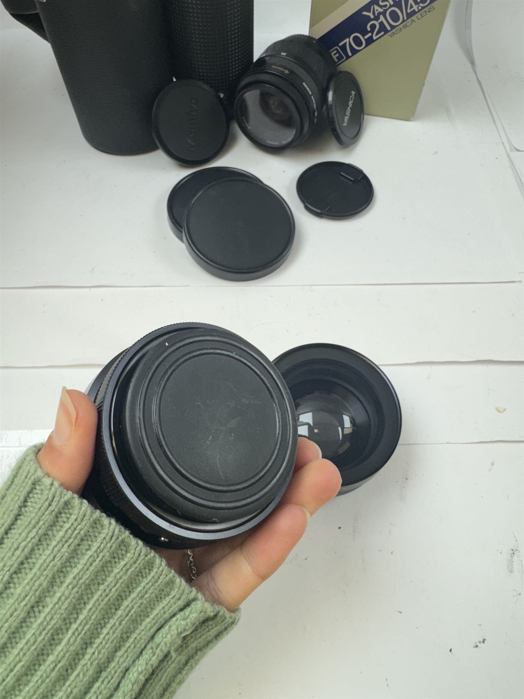 Group of camera lenses, comprising Yashica AF 70-210mm 1:4.5 58mm lens serial no. F6106983, boxed, Yashica AF 35-70mm 1:3.3-4.5 52mm Macro lens serial no. F60231147, Yashikor Aux Wide Angle 1:4 lens and a Yashikor Aux Tele-Photo 1:4 lens, Mamiya-Sekor E 1:2.8 f=28mm serial no. 13427 and a Mamiya-Sekor Zoom E 1:4 f=80-200mm lens serial no. 11271