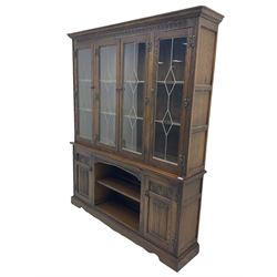 Old Charm oak four door glazed bookcase on cupboard