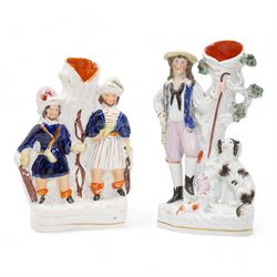 Victorian and later Staffordshire flatbacks, spill vases and figures including 'Gipsy Boy', two modelled as 'Marquess of Lorne and Princess Louise', 'Uncle Tom & Eva', 'Paul & Virginia' and other models, H33cm max (12)
