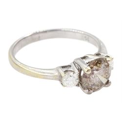 18ct white gold three stone round brilliant cut fancy champagne and white diamond ring, stamped 750, principle diamond approx 1.00 carat
