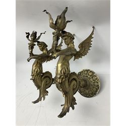 Pair of continental brass wall lights, each in the form of a siren, a mythological winged sea creature, holding a flaming torch H30cm