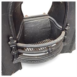 Late Victorian black-painted cast iron fireplace, the arched surround with anthemion cartouche and guilloche-moulded border, enclosing a bow-front fire basket with finialled standards, railed front and leaf-cast apron, with sheet-metal backplate