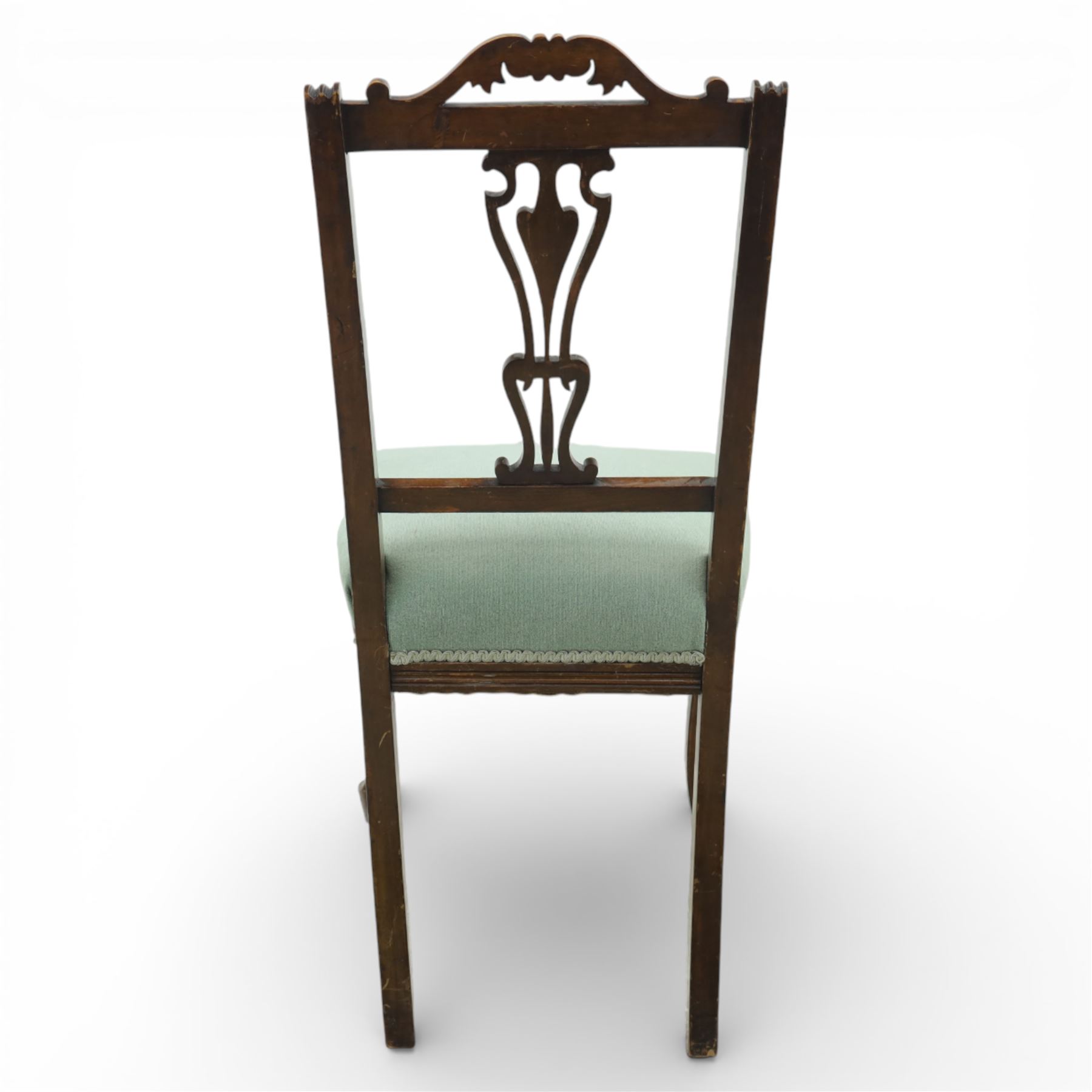 Late Victorian mahogany side chair, the carved cresting rail above a pierced and carved splat with lyre-form detail, the back panel inset with cane work, drop-in upholstered seat in pale green fabric with braid trim, raised on cabriole supports