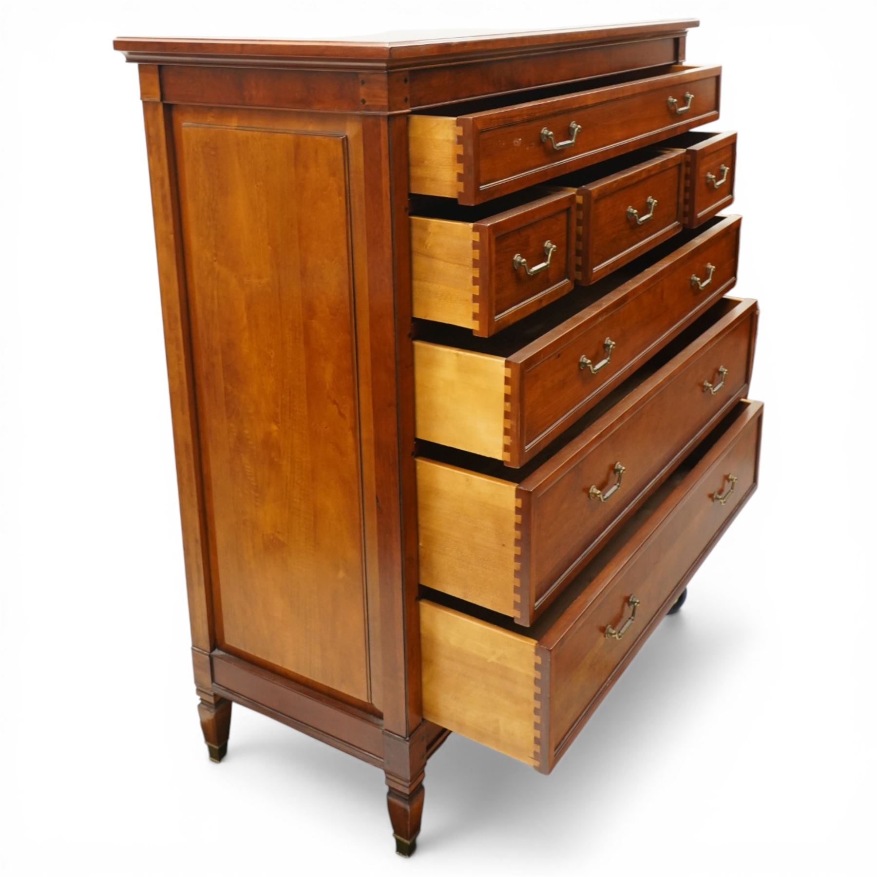 Willis & Gambier - 'Directoire' tall chest of drawers, rectangular top above an arrangement of seven drawers, raised on tapered and turned feet