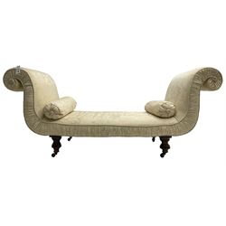 Victorian mahogany framed window seat day bed, the scrolled arms and seat upholstered in ivory foliate patterned damask fabric with matching ropetwist piping, raised on turned supports with castors