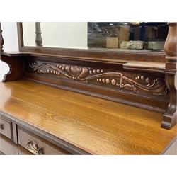Arts and Crafts period oak mirror back dresser, projecting cornice above rectangular bevelled mirror and shelf, two turned supports, inset copper panel with embossed decoration, rectangular moulded top over two drawers and two panelled cupboard, moulded plinth base, brass and copper strappings and handles 