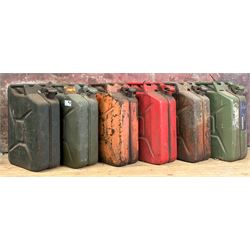 Near set of six jerry cans. 