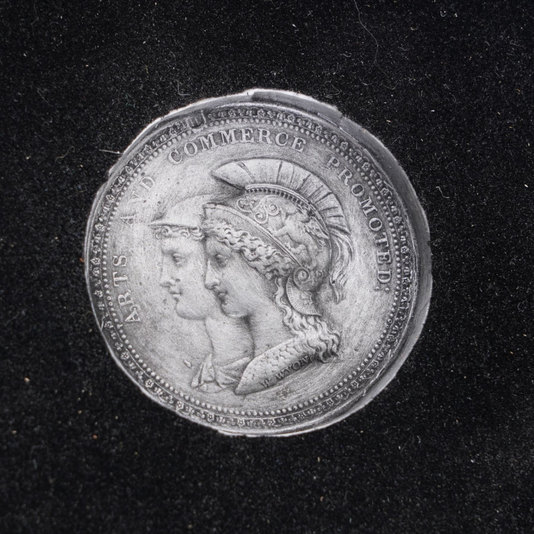 Modern sculpture of a boar, the base inset with an 'Arts and Commerce Promoted' medallion and marked 'England' on rectangular base H22cm