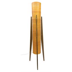 Mid century floor standing rocket lamp, the spun cylindrical orange fibreglass shade supported by three tapering teak legs, H112cm