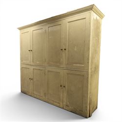 Large Georgian painted pine housekeepers cupboard, projecting cornice with four sets of twin cupboard doors with shelving enclosed