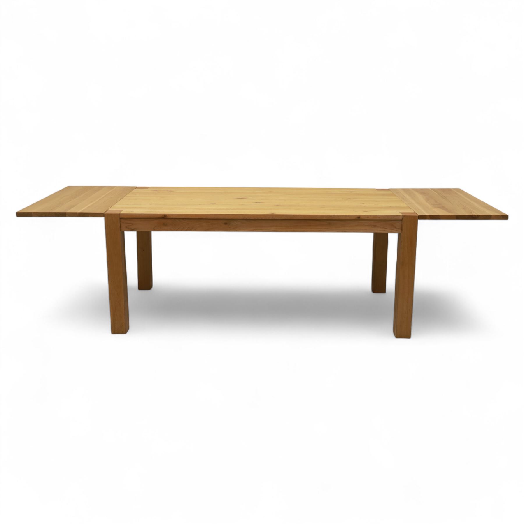 Modern oak dining table, rectangular form with detachable twin leaf extensions, supported on straight square-section legs (Extends to 280cm) 