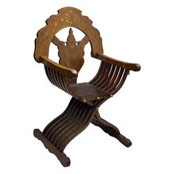 Late 20th century brass inlaid hardwood throne chair, curved X-frame form, raised shaped back inlaid with trailing leafy branches and flower heads, on sledge feet 
