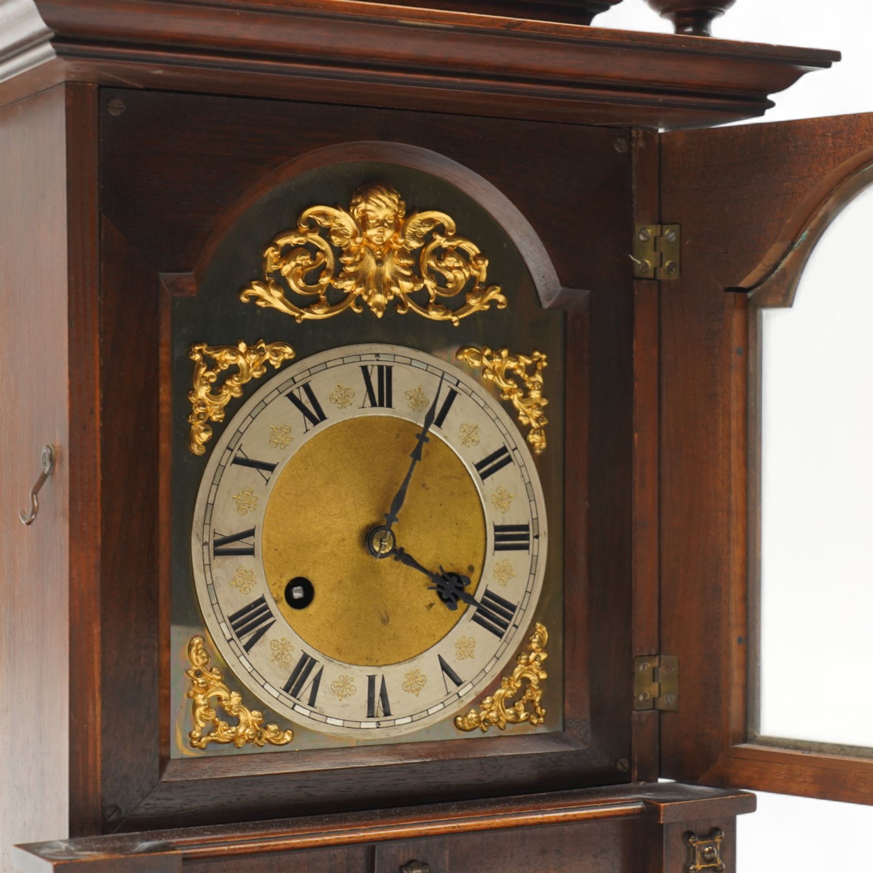 German-Junghans late 19th century oak cased mantle clock, with a domed pediment and three matching turned finials, break arch door beneath with attached turned and tapered pilasters, brass dial with cast spandrels, matted dial centre, steel hands and silvered chapter ring with Roman numerals, two train movement striking the hours and half-hours on a coiled gong. With pendulum and key.