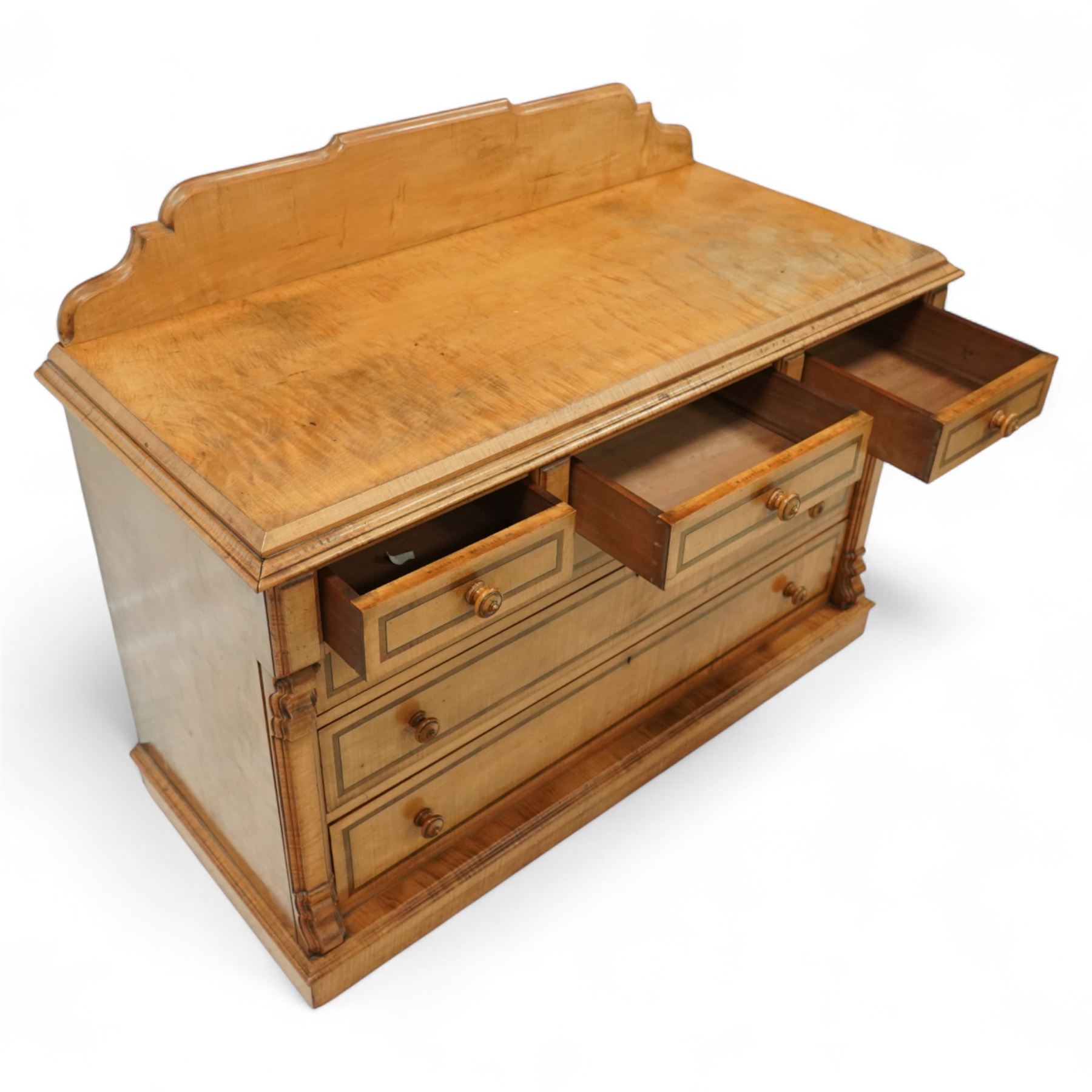 William Snowdon of Rochdale (fl.1876-1886) - Victorian sycamore chest of drawers, rectangular top with shaped gallery back above an arrangement of three short and three long drawers, each with moulded borders and turned wooden pulls, flanked by carved upright corbels, on a plinth base (99cm height including gallery)