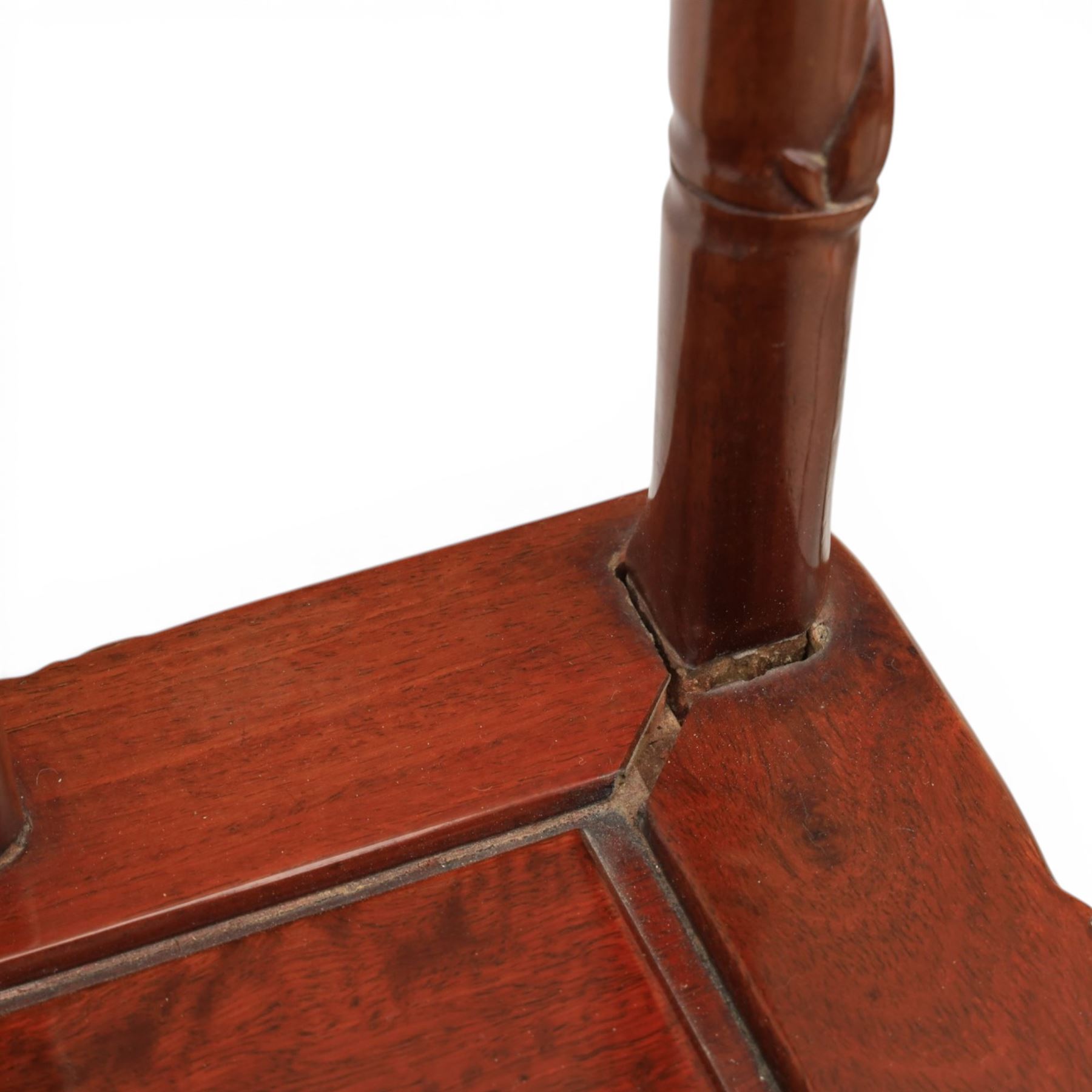20th century Chinese ornately hardwood dining table and chairs, circular table with 'Lazy Susan' top with pierced carved frieze, raised on a quadriform base with carved foliate detail, the chairs en suite with carved pierced detailing  