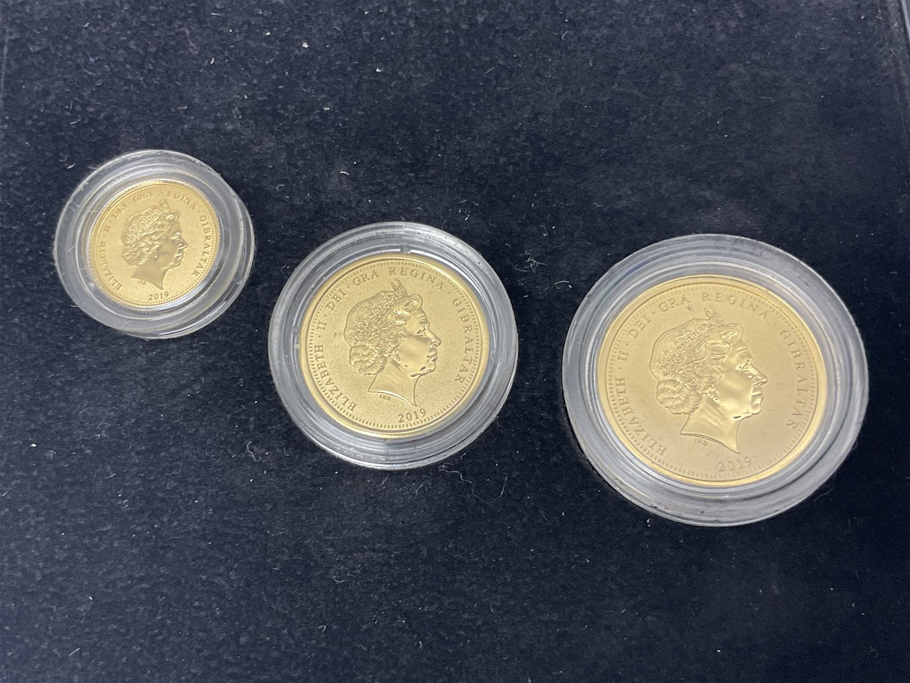 Queen Elizabeth II Gibraltar 2019 'The Concorde 50th Anniversary Gold Sovereign Prestige Set', comprising full, half and quarter sovereigns, cased with certificate, together with various items of Concorde memorabilia including cased binoculars, flight certificate for Heathrow to Moscow, 'Concorde Through The Lines' photographic tribute book etc