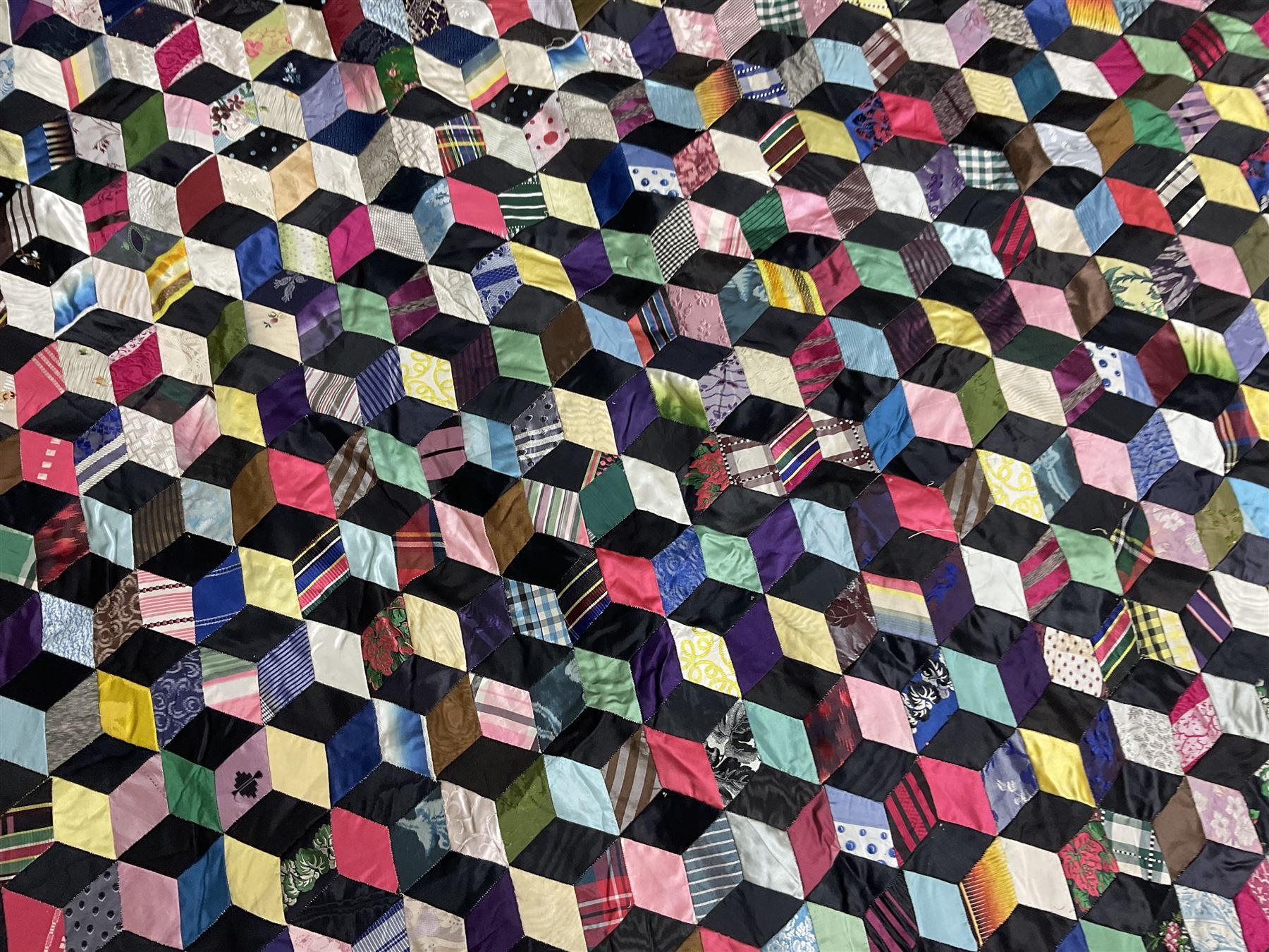 19th Century silk and satin tumbling blocks pattern patchwork quilt with black border 228cm X 196cm