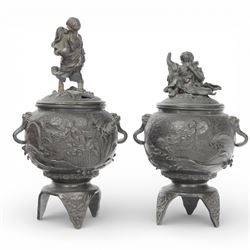 Pair of Japanese bronze koro, raised upon three feet, he body of the koro decorated with figures and animals, the cover mounted with figures, H24cm