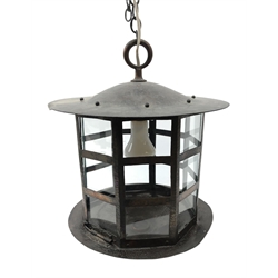  Arts & Crafts oxidised copper hall lantern, octagonal cage work shade with copper rivets and clear glass panels (lacking two), slightly domed top with loop handle on conforming base with turned finial, H40cm x D31cm approx  