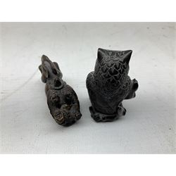 Group of ten Japanese netsukes, comprising eight carved wooden examples, and two ivorine examples, of various form, examples modelled as pigs, owl, mouse with tortoise upon its back, birds, rabbit, etc. 