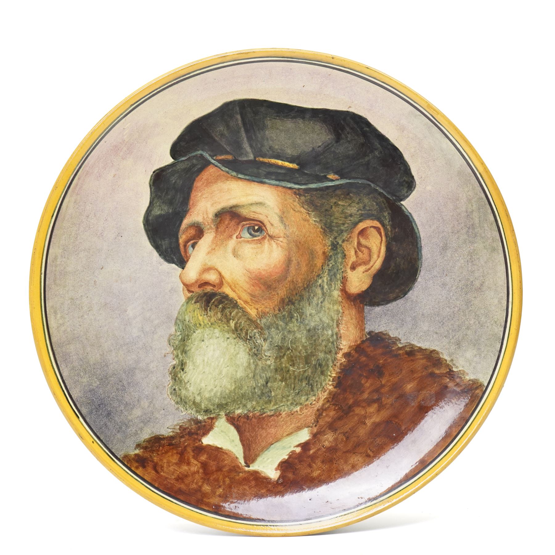 Pinder Bourne & Co hand-painted faience charger, c1879, by James R Cruickshank, depicting a bearded man in a tied black cap, impressed mark and with artists monogram to base, D40cm